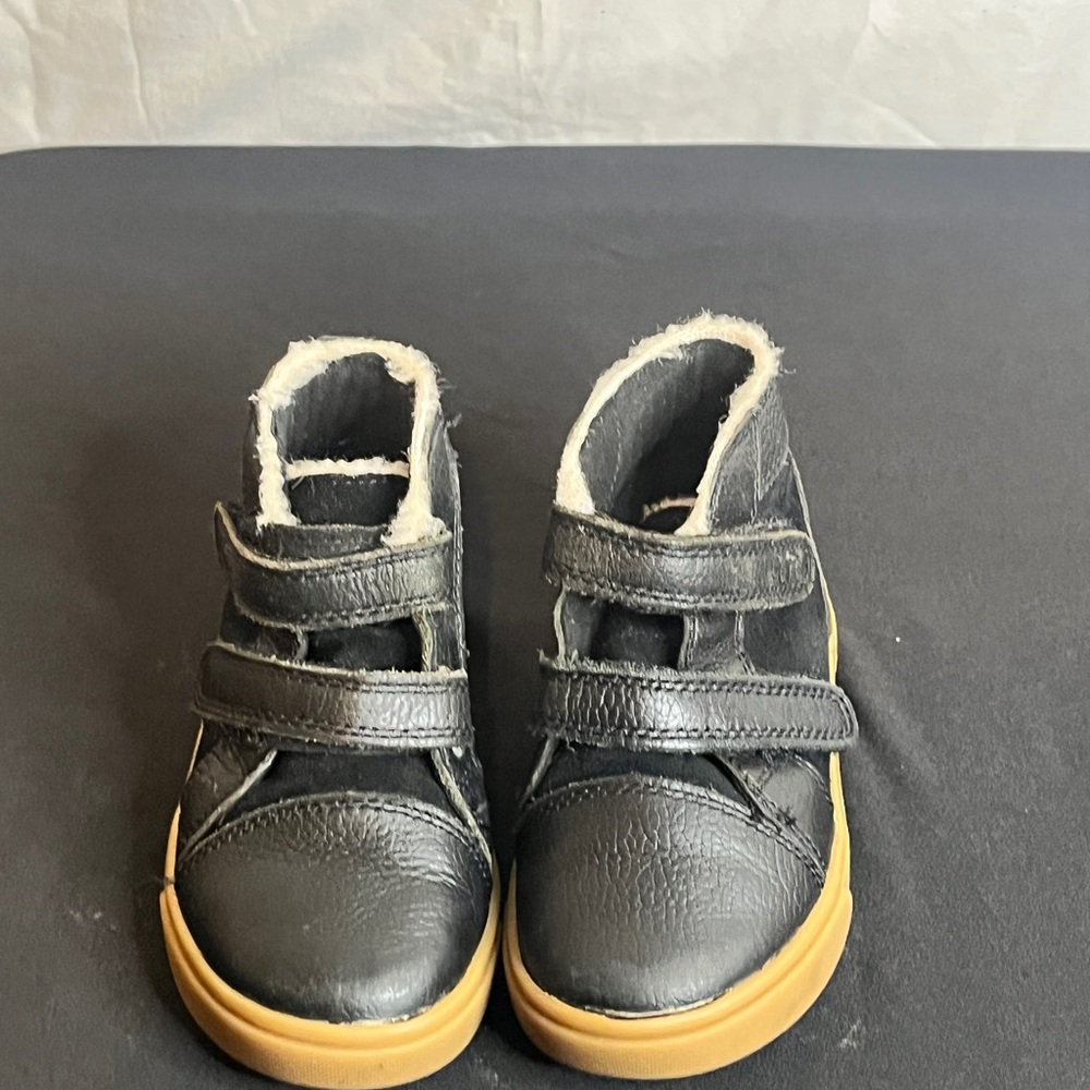 UGG Black and Tan Boots with Classic Design